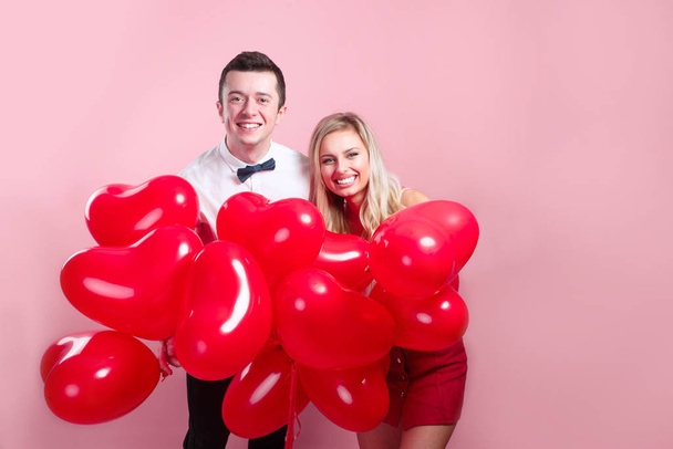 Loving happy couple with Valentines day balloons - Φωτογραφία, εικόνα