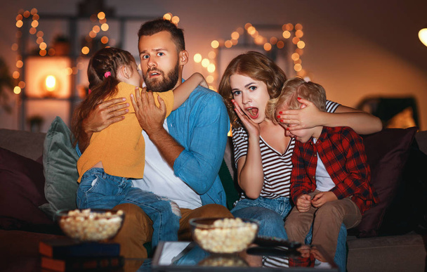family mother father and children watching projector, TV, movies - Photo, Image