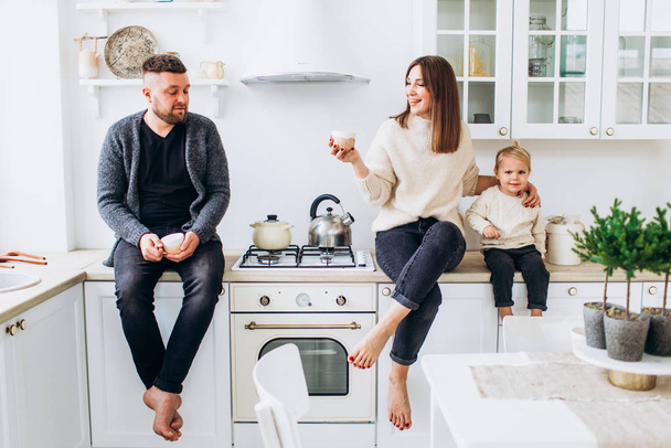 Happy family in a bright kitchen. Happy childhood. - Fotó, kép