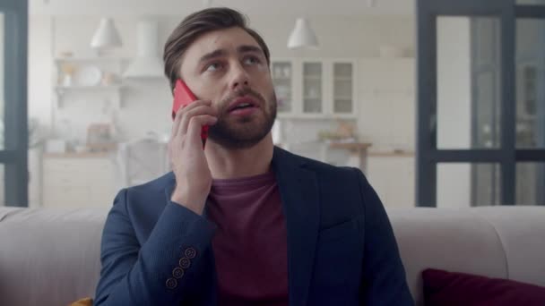 Focused business man making phone call at home. Freelancer speaking phone. - Πλάνα, βίντεο