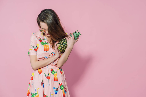 Pineapple in ladys hands. Trendy and stylish fashion. - Foto, Imagem