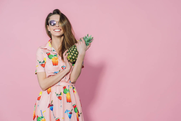 Pineapple in ladys hands. Trendy and stylish fashion. - Фото, зображення