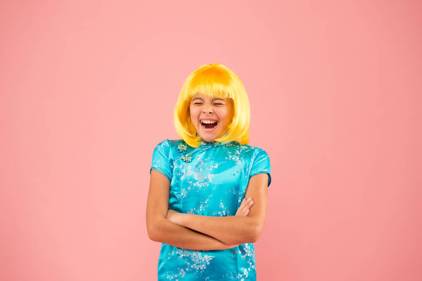 Pop culture. Anime fan. Cosplay kids party. Child cute cosplayer. Cosplay outfit. Otaku girl wig smiling pink background. Cosplay character concept. Hobby and entertainment. Eastern trends for teens - 写真・画像