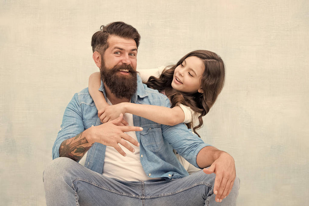 Honoring fathers and celebrating fatherhood. Little daughter hugging father on fathers day. Bearded man and small child celebrating international fathers day together. Happy fathers day - Foto, Imagen