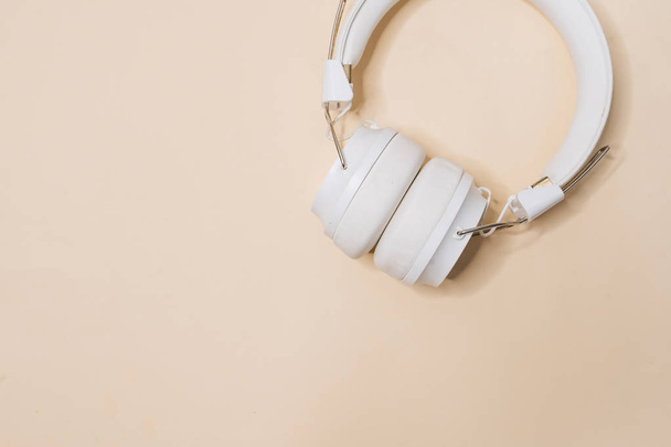 White modern headphones, listening music - Zdjęcie, obraz