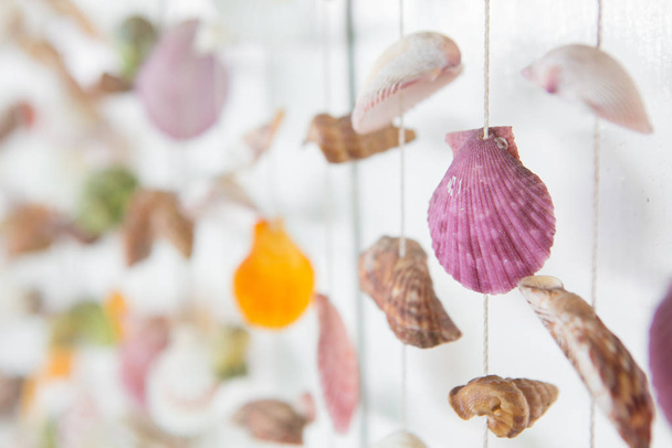 Selective focus of Colorful Mobile Shell on white wooden backgro - Photo, Image