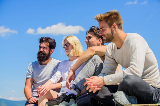 Happy to be a family. group of four people. great fit for day off. happy men and girl relax. diverse young people talking together. best friends. Summer vacation. Group of people in casual wear - Foto, Bild