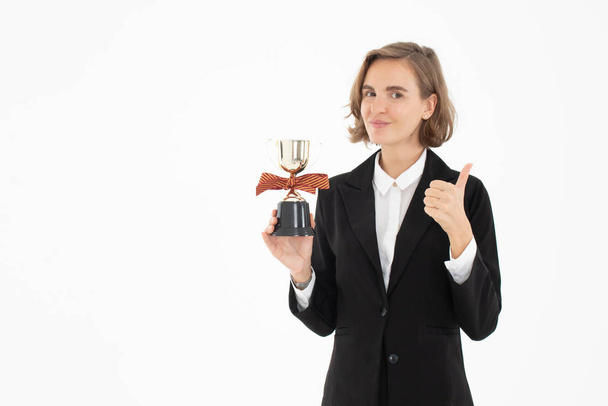 Portrait of successful business woman hoding trophy on white iso - Photo, image