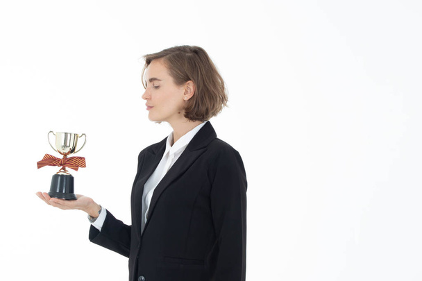 Portrait of successful business woman hoding trophy on white iso - Foto, Imagen