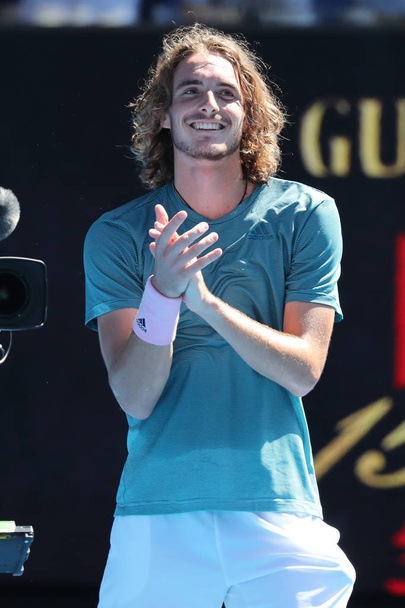 MELBOURNE, AUSTRALIA - JANUARY 21, 2019: Professional tennis player Stefanos Tsitsipas of Greece in action during his quarter-final match at 2019 Australian Open in Melbourne Park - Zdjęcie, obraz