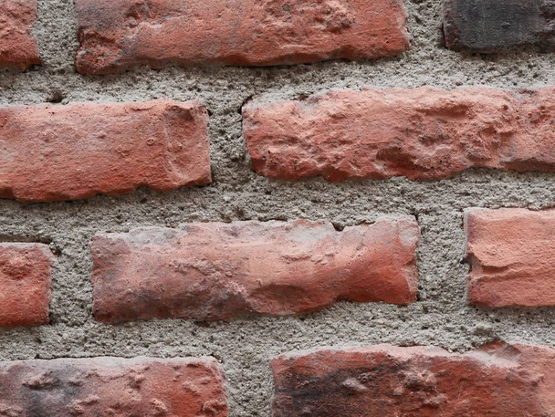 Texture du papier peint mur de briques et de ciment avec des couleurs rouges, orange et gris
 - Photo, image