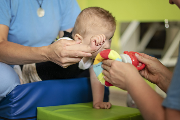 Portrait of a baby with cerebral palsy on physiotherapy  - Photo, Image