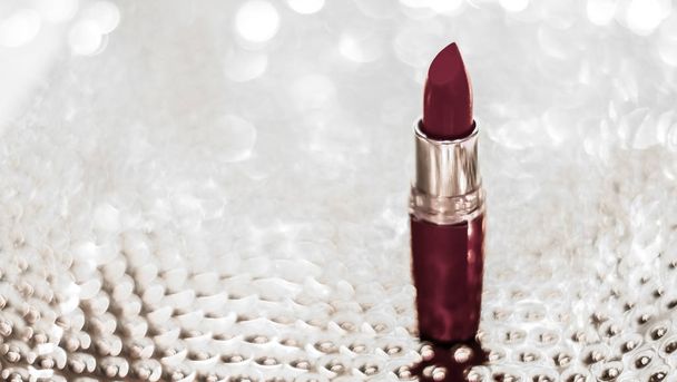 Chocolate lipstick on silver Christmas, New Years and Valentines - Photo, Image