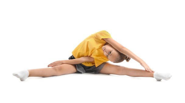 Little girl practicing yoga on white background - Foto, Bild