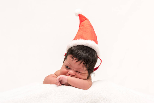mixed race newborn baby in santa hat isolated on white  - Foto, Imagem