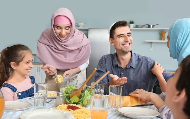 Muslim family having dinner at home - Foto, Imagen