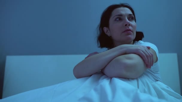 Middle-aged woman crying in bed alone, coping with divorce, health problems - Séquence, vidéo