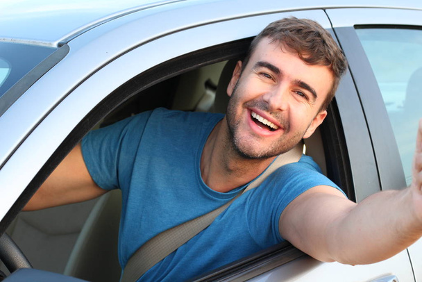 Attractive man driving a car, closeup portrait - Photo, Image