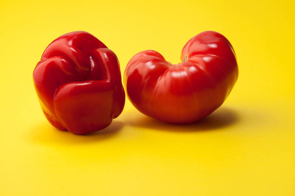 Ugly organic vegetables on a yellow background. - Photo, image