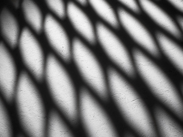 Black shadows on a white wall. Abstract background or texture. - Foto, Imagem