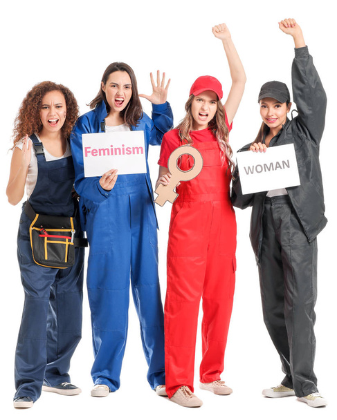Female workers on white background. Concept of feminism - Photo, Image