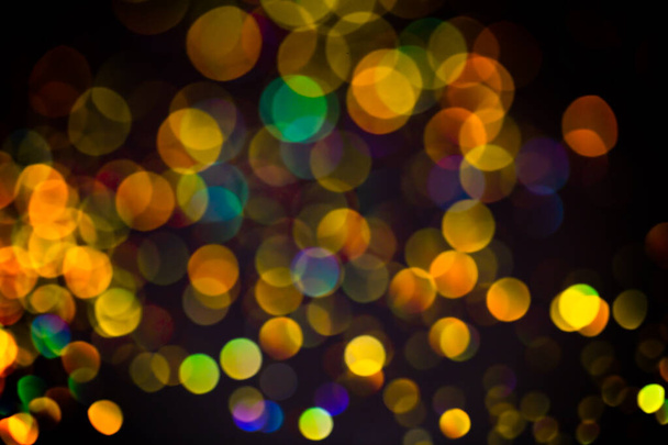Multicolor glitter raster background. Abstract shimmering red circles on deep purple backdrop. Vibrant bokeh lights effect festive illustration. Overlapping glowing and twinkling spots. - Photo, image