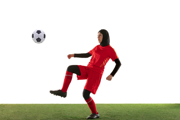 Arabian female soccer or football player isolated on white studio background - Foto, Imagem