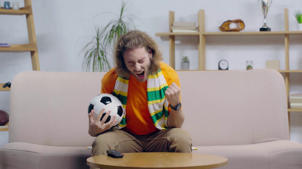 excited bearded football fan watching championship  - Filmagem, Vídeo