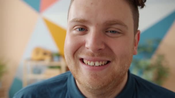 Headshot of happy young attractive man smiling laughing looking at camera indoors - Materiał filmowy, wideo