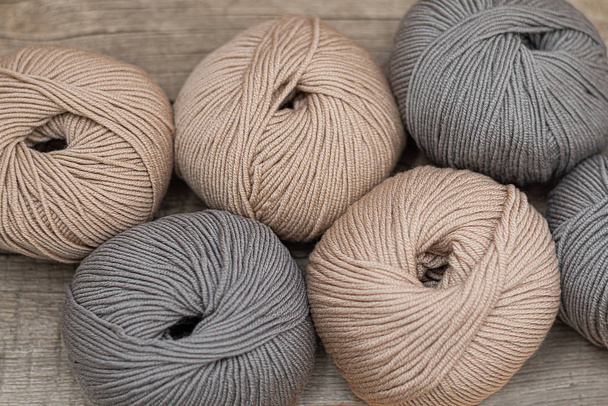 Close up of wool knitting on wooden background - Φωτογραφία, εικόνα