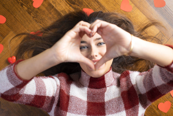 Woman making heart shape with hand - Photo, image