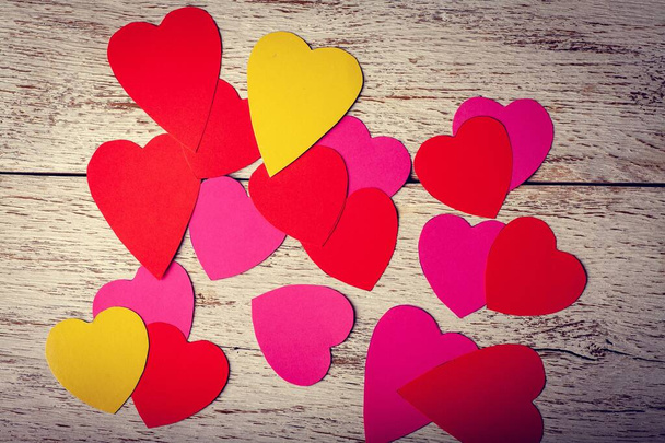 Colored paper hearts on a wooden background. Holidays. Valentine's Day. - Photo, Image