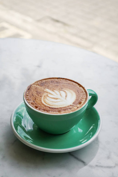 A cup of coffee with latte art on top  - Φωτογραφία, εικόνα