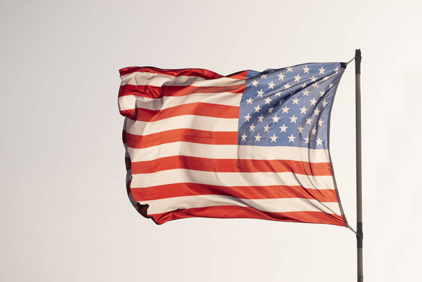american flag over a blue sky - Foto, Imagen