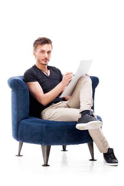 Portrait of a male sitting on chair - Photo, Image