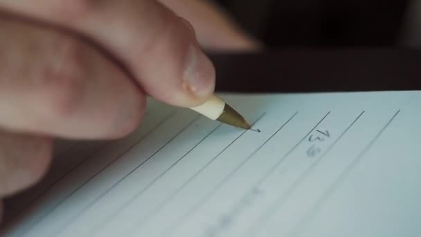 A man takes notes in a diary - Séquence, vidéo