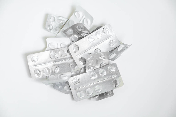 Used drugs, Used capsules, Used antibiotic packaging on white background, Close-up of empty package - 写真・画像
