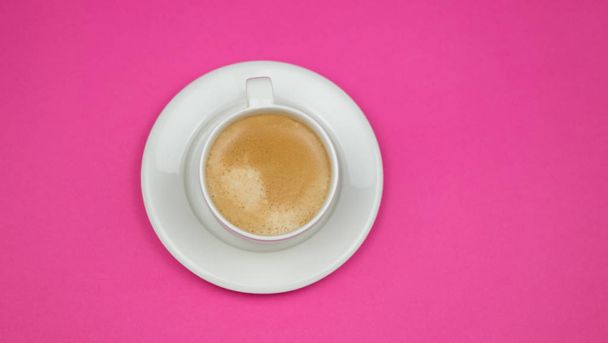 Creative flat lay overhead top view coffee milk latte cup on millennial pink background copy space minimal style. feminine blog social media - Fotoğraf, Görsel