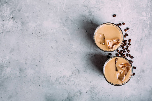 Vegan coconut milk coffee and coffee beans in two glasses on dar - Fotografie, Obrázek
