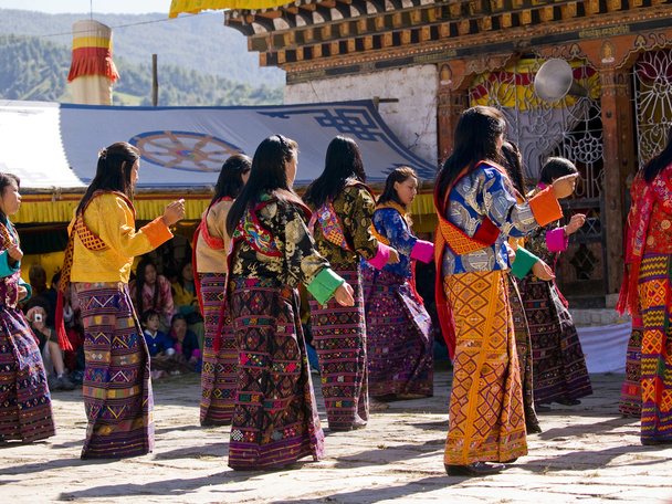 Women wearing traditional kira dresses at the Jakar tsechus - Photo, Image