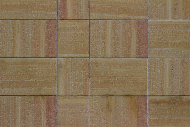 Modern beige and brown color stone block wall texture background with natural stone containing varying color striations - Φωτογραφία, εικόνα