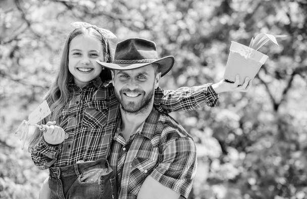 father and daughter. family farm. agriculture. little girl and happy man dad. earth day. new life. spring village country. ecology environment. soils and fertilizers. I love to work with plants - Fotoğraf, Görsel