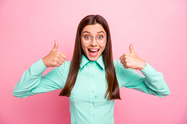 Photo of amazing lady raising thumbs up overjoyed expressing agreement well-done work wear specs turquoise shirt with collar isolated pink color background - Fotografie, Obrázek