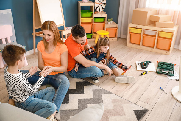 Family assembling furniture at home - Photo, Image