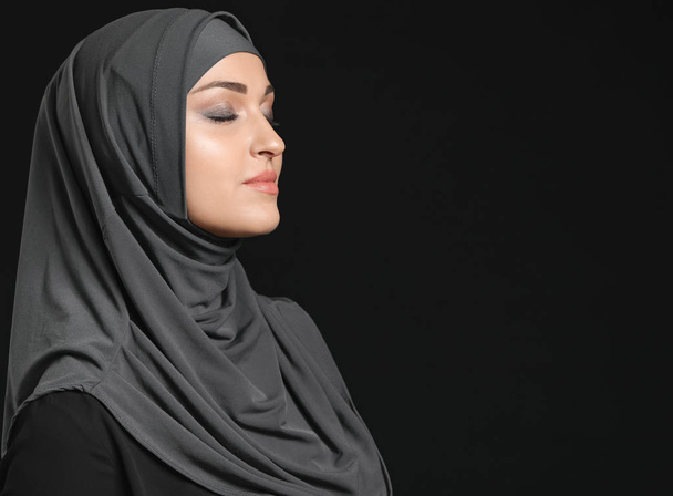 Beautiful Arab woman on dark background - Fotó, kép