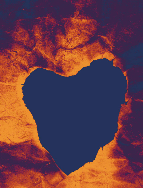 Heart shaped burnt out of a paper - Photo, Image