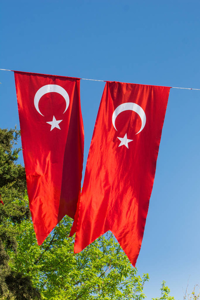 Turkish national flags hang in view in the open air - Photo, Image