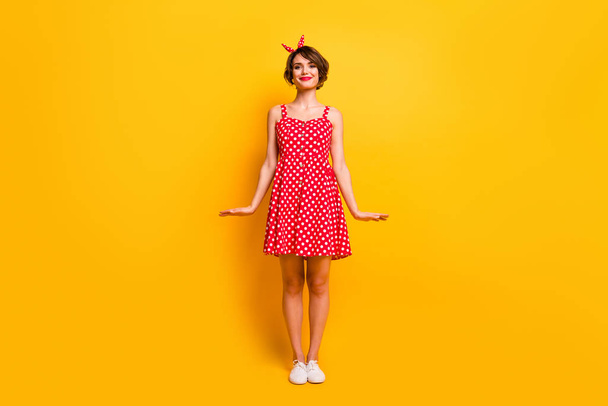 Full size photo of charming nice girl enjoy spring free time walk feel content wear retro style polka-dot clothes footwear isolated over shine color background - Valokuva, kuva