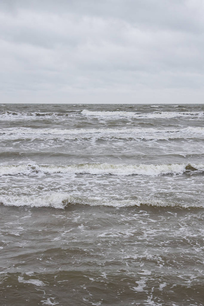 Sea view of Baltic sea waves on a cloudy and stormy winter d
 - Фото, изображение