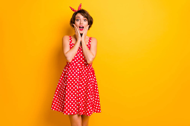Portrait of astonished girl hear unbelievable unexpected novelty impressed touch hands face scream wear polka-dot skirt isolated over vivid color background - Photo, Image